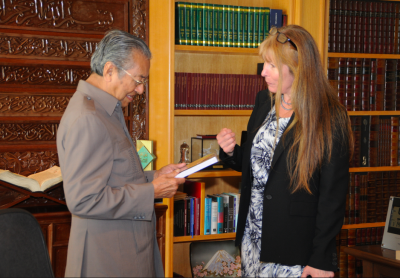 Handed the book Money Logging by SR - he seems to have opened it.