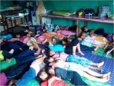 Sleeping facilities in a Sarawak rural boarding school with leaking roof above.  