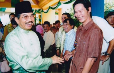 Musa Aman with his bag man Michael Chia, caught laundering tens of millions in timber kickbacks.